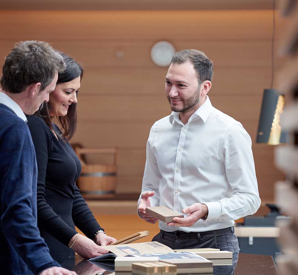  team standing in a circle having a meeting